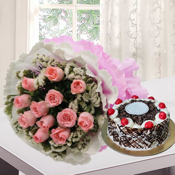 12 Pink Roses in White and Pink Paper, Pink Rafia Bow with Half Kg Black Forest Cake